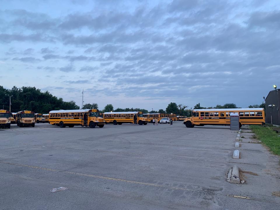 Buses pull up to the depot to take students to school on another first day for JCPS