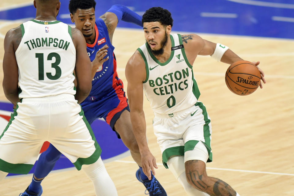 Boston Celtics forward Jayson Tatum drives to the basket against the Detroit Pistons during the first half of an NBA basketball game Sunday, Jan. 3, 2021, in Detroit. (AP Photo/Jose Juarez)