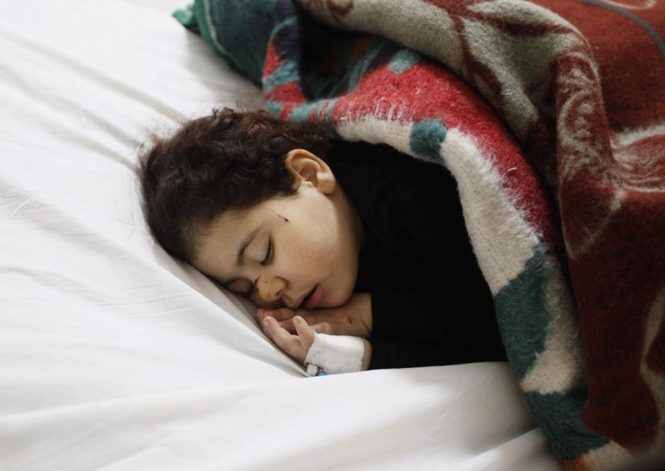 An injured girl recuperates in hospital after an explosion at a security building in Egypt's Nile Delta city of Mansoura