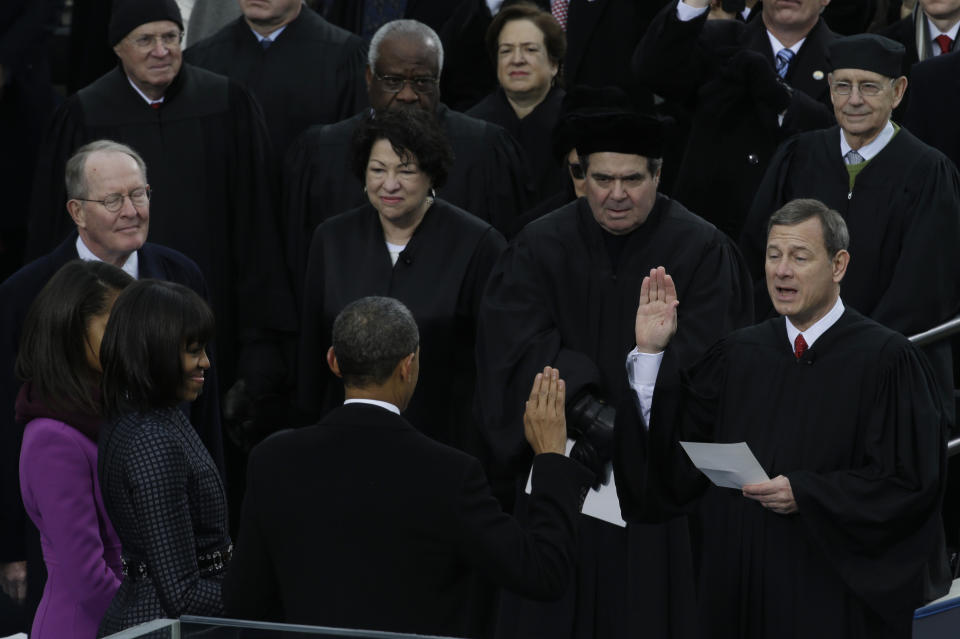 FILE - In this Jan. 21, 2013, file photo Chief Justice John Roberts, right, reads the oath of office to President Barack Obama at the ceremonial swearing-in at the U.S. Capitol during the 57th Presidential Inauguration in Washington. (AP Photo/Paul Sancya, File)