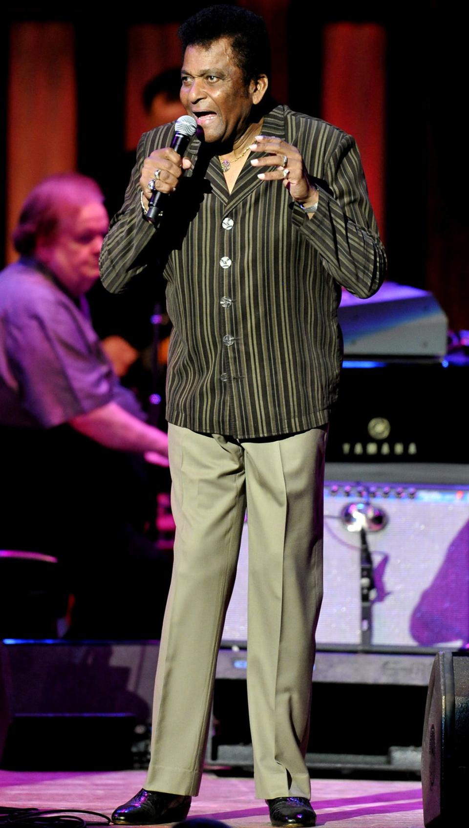 Charley Pride performs during the Grand Ole Opry show at the Ryman Auditorium on Feb. 3, 2012.