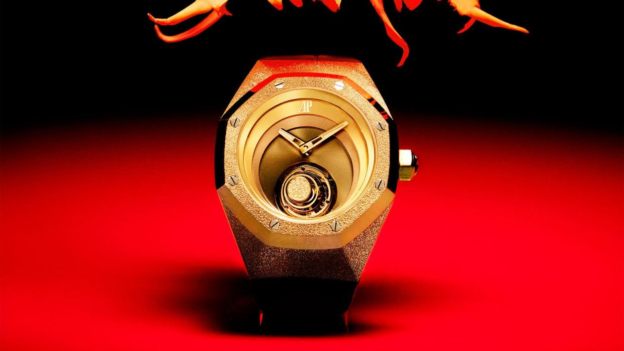 a black and red hued image with an expensive rose gold watch at center