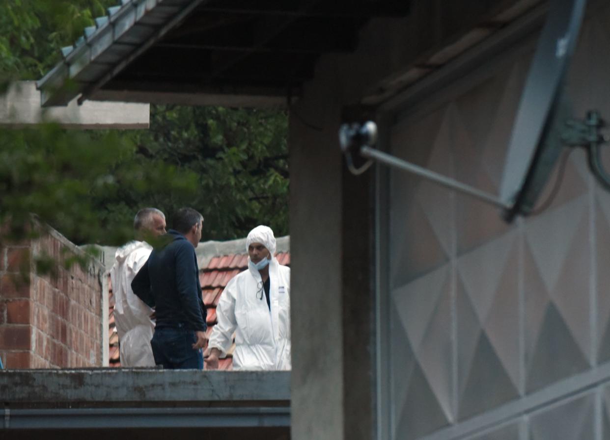 Police investigators on the site of the attack in Cetinje, 36 kilometers (22 miles) west of Podgorica, Montenegro, on Friday.