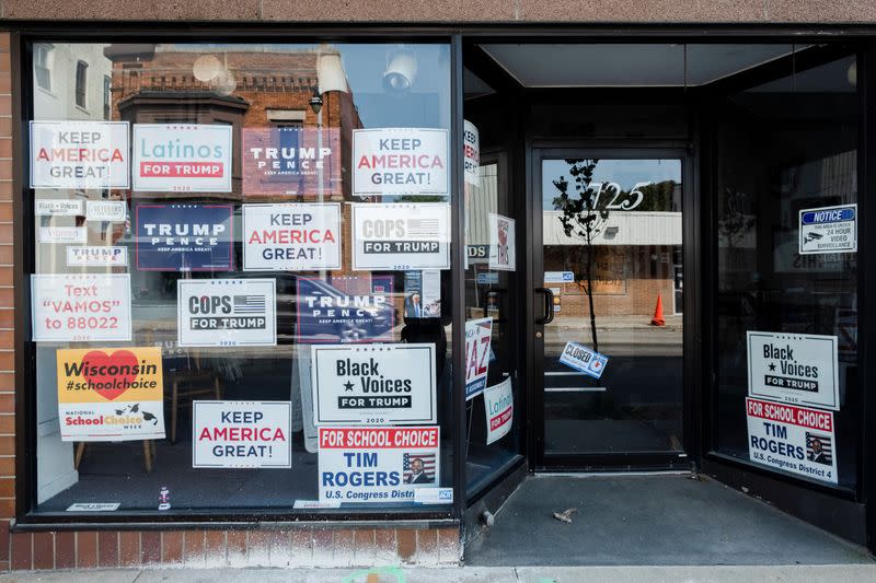 A range of posters showing support to U.S. President Donald Trump hangs on the heart of the historic Mitchell Street in Milwaukee