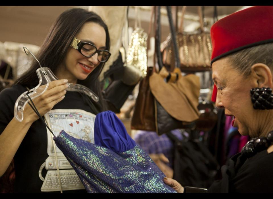 Dell checking out some vintage dresses from dealer Liz Baca's of The Goods.