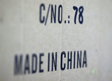 Words 'Made in China' are pictured on a box of products imported from China at a wholesale shop in Paris