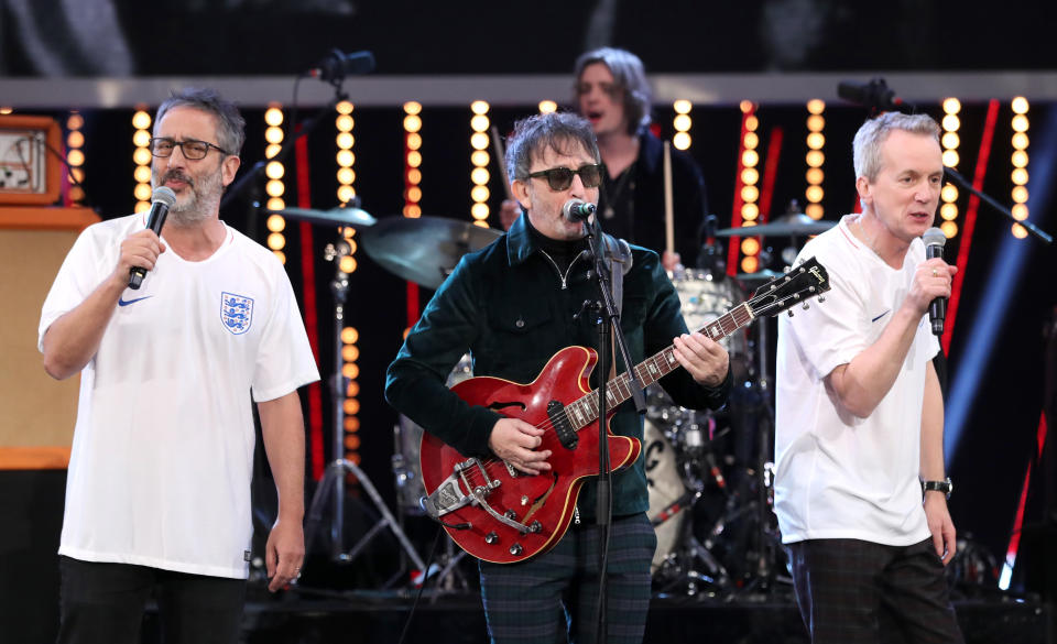Baddiel and Skinner's Euro 96 hit (seen here performing Three Lions in 2018 with Ian Broudie) topped the UK charts a record four times. (Getty)