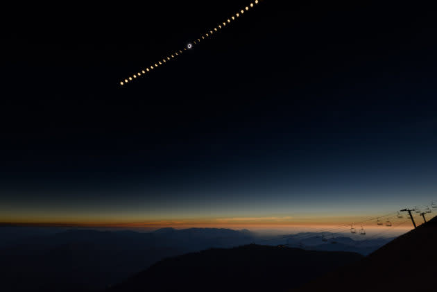 A composite image shows the progression of the solar eclipse from partial to total and back to partial again, as seen from the summit of Bald Mountain at the Sun Valley ski resort in Idaho. (Kevin Lisota Photo)