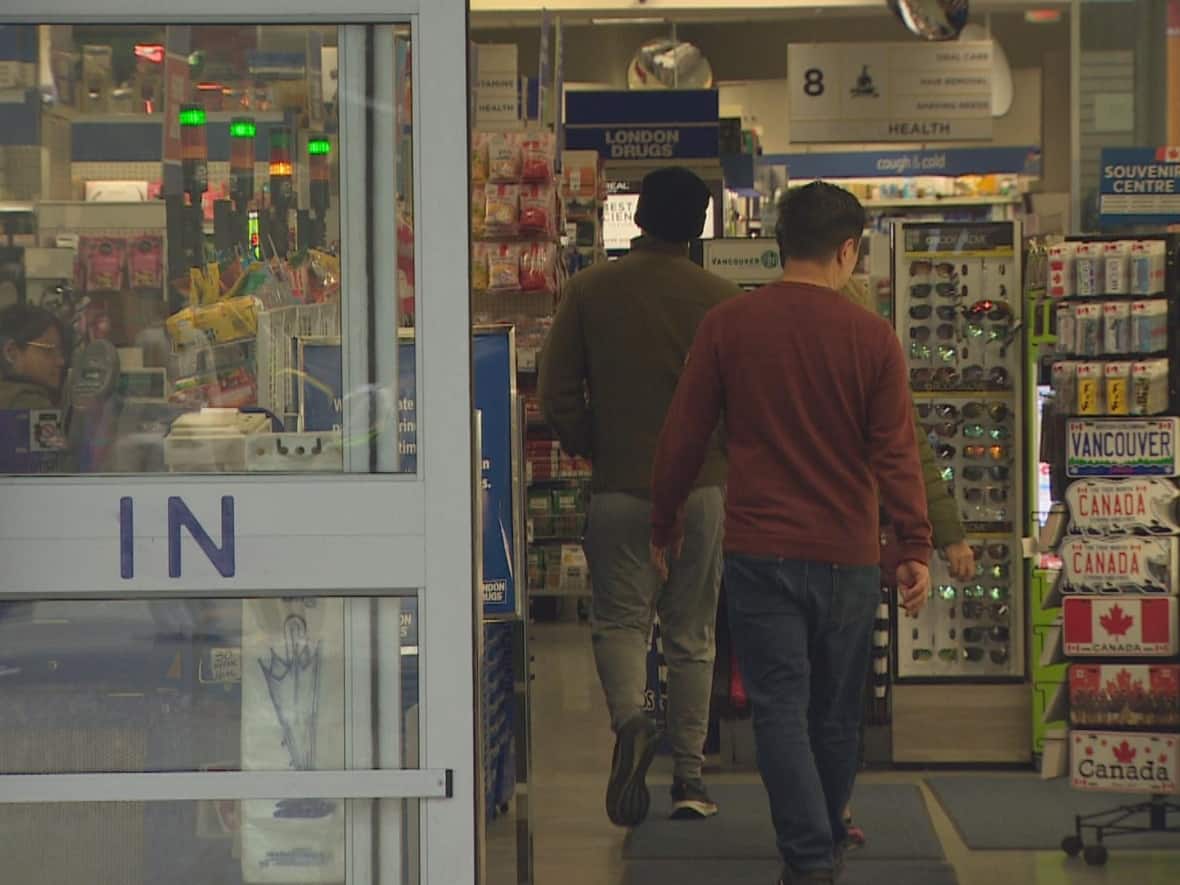Customers enter the Granville Street London Drugs in downtown Vancouver, which reopened Sunday for the first time since a cyberattack hit the company. (CBC News - image credit)