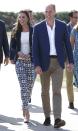 <p>Middleton wears printed skinny ankle pants by Gap, a white top, navy blazer, and nude wedged espadrilles while out in Cornwall with Prince William.</p>