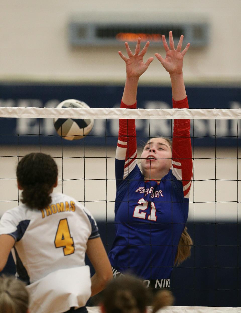 Fairport's Meghan Clifford tries to block a shot by Thomas's  Chloe Scott.