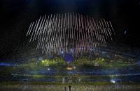 Confetti rains down at the end of the closing ceremony for the 2014 Sochi Winter Olympics, February 23, 2014. REUTERS/Phil Noble (RUSSIA - Tags: OLYMPICS SPORT)