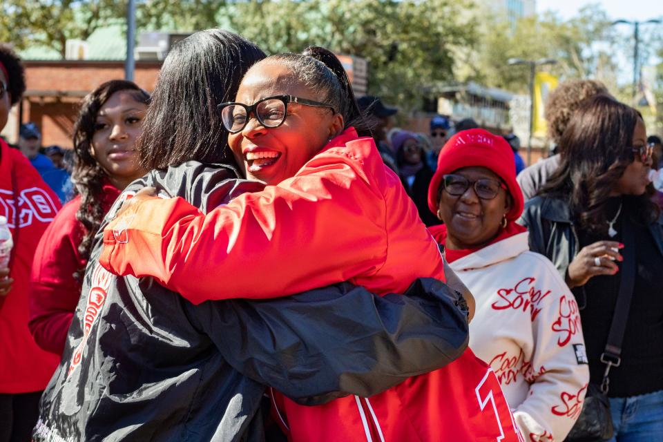 Anyana Stokes (left) hugs Veita Jackson-Carter, president of Gainesville Alumnae Chapter of Delta Sigma Theta Sorority, Inc., before the King Celebration Annual Commemorative Parade in downtown Gainesville on Monday, Jan. 16, 2023.
(Photo: Lauren Witte/Special to the Sun)