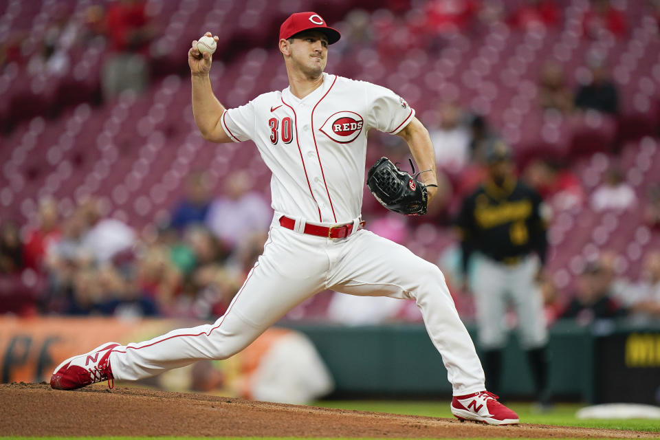 Cincinnati Reds' starting pitcher Tyler Mahle (30) throws during the first inning of a baseball game against the Pittsburgh Pirates in Cincinnati, Tuesday, Sept 21, 2021. (AP Photo/Bryan Woolston)