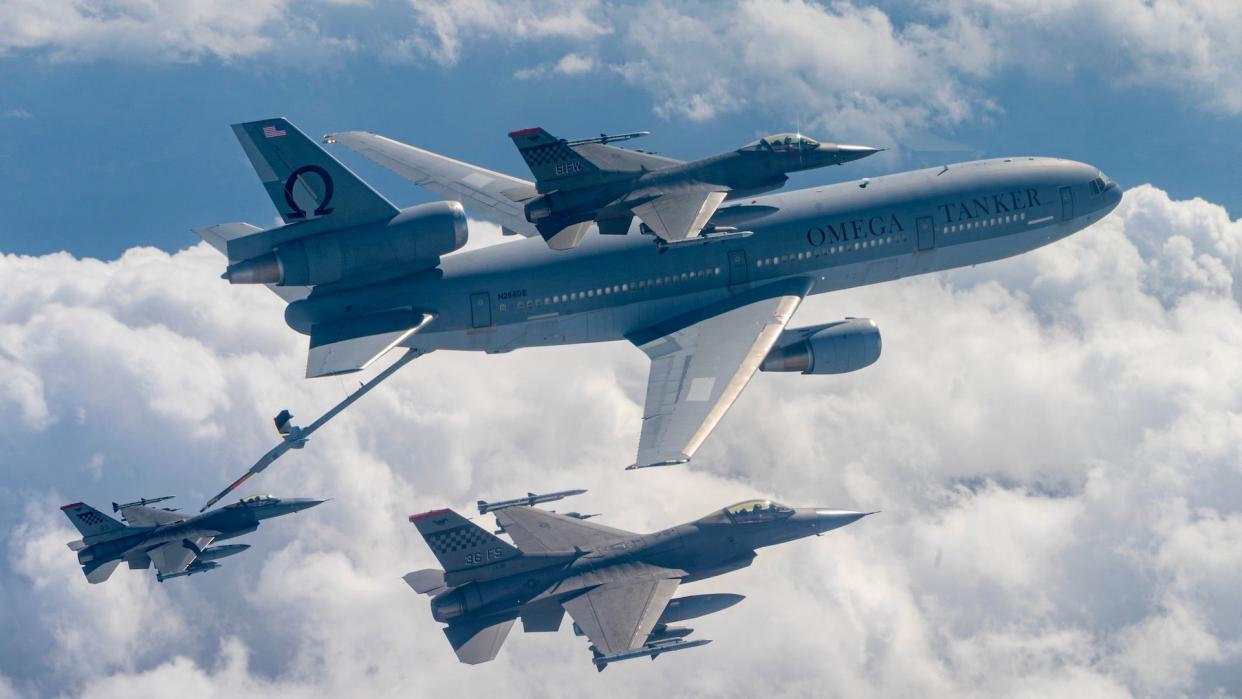 A commercial KDC‐10 tanker aircraft refuels a U.S. Air Force F‐16 Fighting Falcon from the 51st Fighter Wing, enroute Commando Sling 23 at Paya Lebar Air Base, Singapore, November 6, 2023.