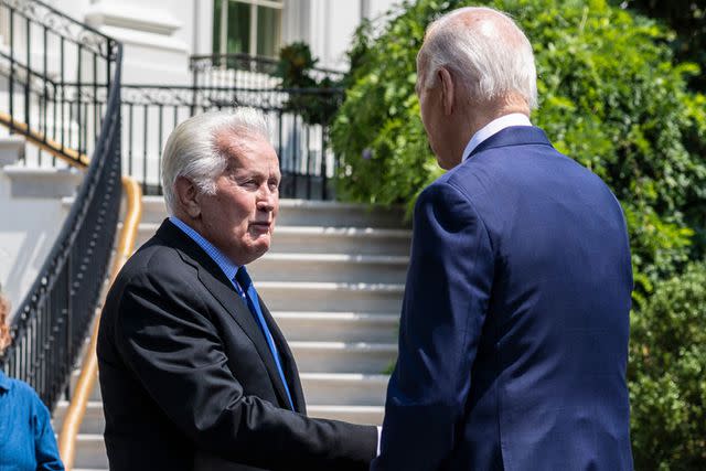 <p>Anna Rose Layden/Bloomberg via Getty </p> Joe Biden shakes hands with Martin Sheen