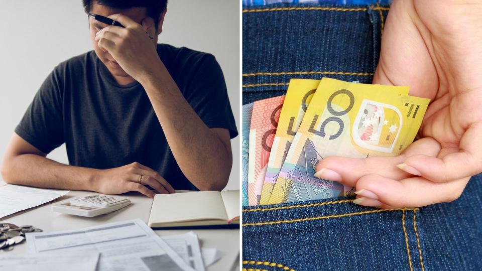 Man with head in hand, stressed while looking at financial situation. Close up of Australian money in jean pocket. 