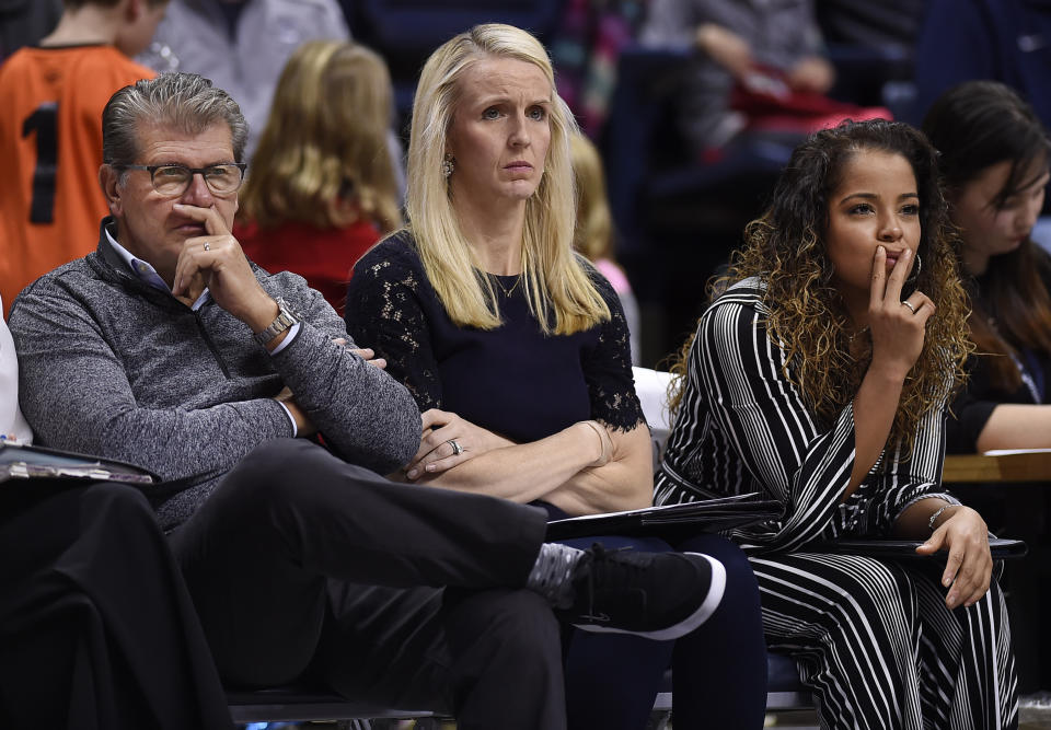 FILE - Connecticut head coach Geno Auriemma, left, watches play with assistant coaches Shea Ralph, center, and Jasmine Lister, right, during the second half of an NCAA exhibition women's college basketball game against Vanguard in Storrs, Conn., in this Sunday, Nov. 4, 2018, file photo. Vanderbilt has hired Shea Ralph away from UConn to help revive the Commodores' struggling women's basketball program. Athletic director Candice Lee announced the hiring Tuesday morning, April 13, 2021, a week after firing Stephanie White. (AP Photo/Jessica Hill, File)