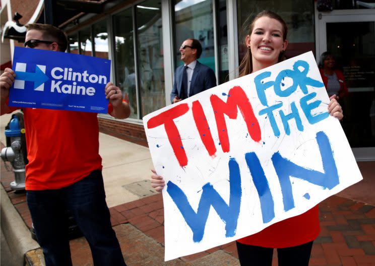 Tim Kaine supporters wave signs to passing motorists ahead of tonight's debate at Longwood University in Farmville, Va. (Photo: Kevin Lamarque/Reuters)