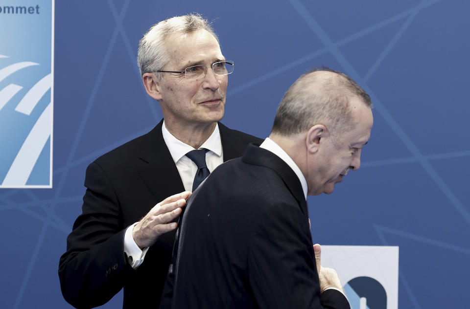 NATO Secretary General Jens Stoltenberg, left, greets Turkey's President Recep Tayyip Erdogan as he arrives for a NATO summit at NATO headquarters in Brussels, Monday, June 14, 2021. U.S. President Joe Biden is taking part in his first NATO summit, where the 30-nation alliance hopes to reaffirm its unity and discuss increasingly tense relations with China and Russia, as the organization pulls its troops out after 18 years in Afghanistan. (Kenzo Tribouillard, Pool via AP)