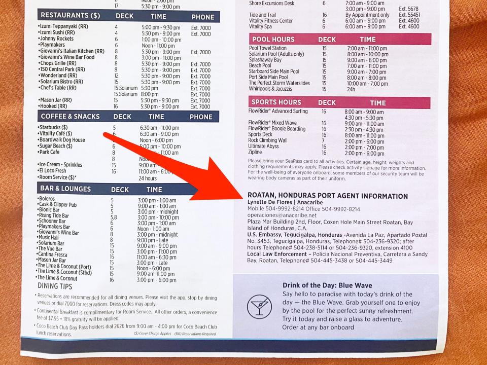 A copy of Royal Caribbean's Cruise Compass on an orange background with a red arrow pointing to the port agent information