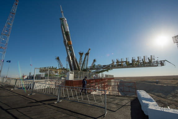 The Soyuz rocket is erected into position after being rolled out to the launch pad by train on Monday, Sept. 23, 2013, at the Baikonur Cosmodrome in Kazakhstan. Launch of the Soyuz rocket is scheduled for September 26 and will send Expedition 3