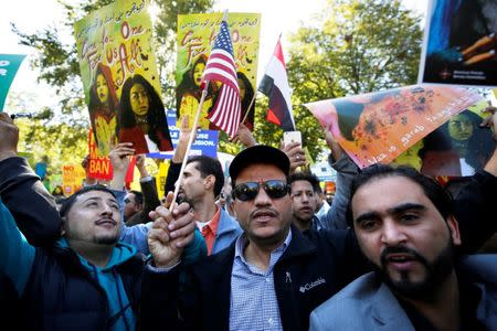 Protesters gather outside the White House for "NoMuslimBanEver" rally against what they say is discriminatory policies that unlawfully target American Muslim and immigrant communities, in Washington, U.S., October 18, 2017. REUTERS/Yuri Gripas