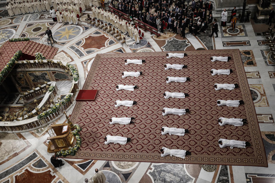 Priests lie face down on the floor during an ordination ceremony presided over by Pope Francis, in St. Peter's Basilica at the Vatican, Sunday, May 12, 2019. (Giuseppe Lami/Pool Photo Via AP)