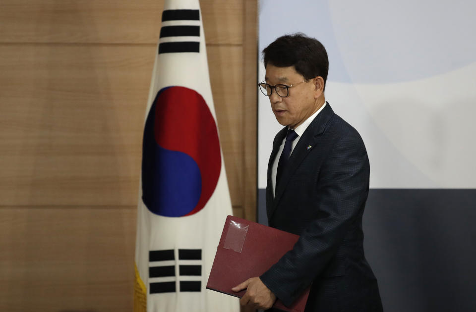 South Korea's Unification Ministry's spokesman Yoh Sang-key, leaves after speaking at a briefing at the government complex in Seoul, South Korea, Wednesday, June 10, 2020. South Korea’s government on Wednesday said it will sue two activist groups that have sent anti-Pyongyang leaflets and plastic bottles filled with rice to the North for allegedly creating tensions between the rivals. (AP Photo/Lee Jin-man)