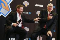 Phil Jackson (R) and New York Knicks owner James Dolan laugh during a news conference announcing Jackson as the team president of the New York Knicks basketball team at Madison Square Garden in New York March 18, 2014. REUTERS/Shannon Stapleton (UNITED STATES - Tags: SPORT BASKETBALL BUSINESS)