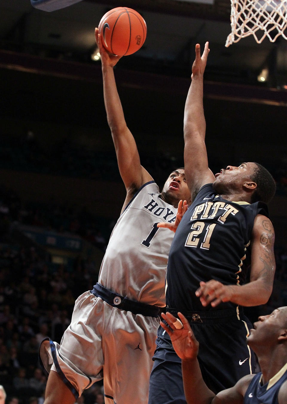 NEW YORK, NY - MARCH 07: Hollis Thompson #1 of the Georgetown Hoyas lays up a shot against Lamar Patterson #21 of the Pittsburgh Panthers during their second round game of the 2012 Big East Men's Basketball Tournament at Madison Square Garden on March 7, 2012 in New York City. (Photo by Jim McIsaac/Getty Images)