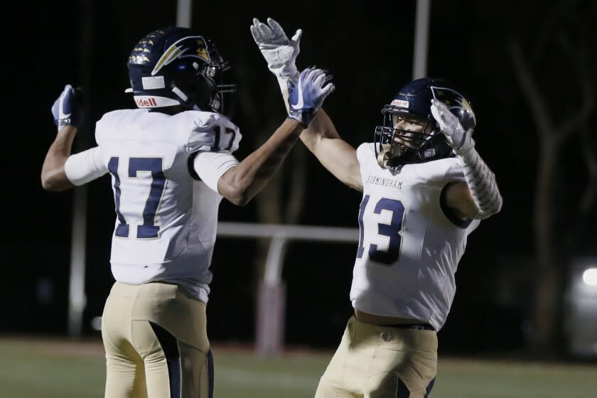 Birmingham wide receiver Peyton Waters celebrates with Ace Acosta after a touchdown catch