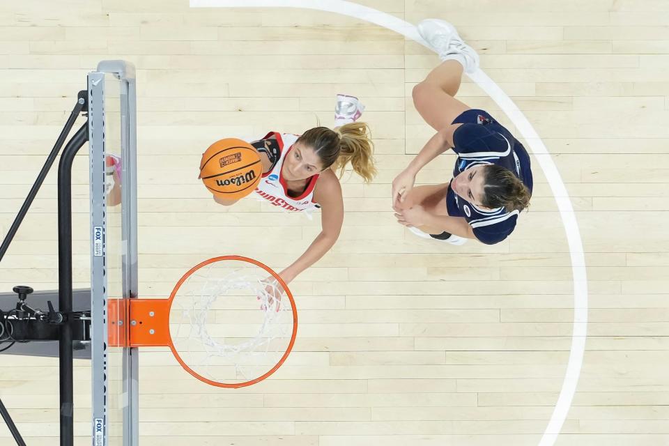 Mar 22, 2024; Columbus, OH, USA; Ohio State Buckeyes guard Jacy Sheldon (4) makes a layup in front of Maine Black Bears forward Adrianna Smith (33) during the second half of the women’s basketball NCAA Tournament first round game at Value City Arena. Ohio State won 80-57.