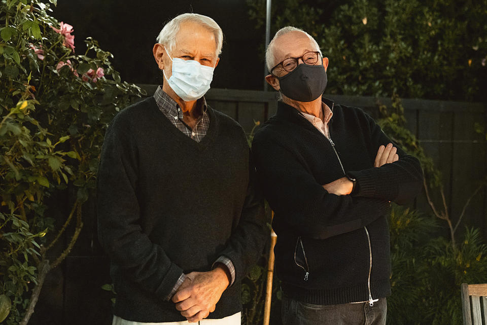 In this Monday, Oct. 12, 2020 photo provided by Stanford University, Robert Wilson, left, and Paul Milgrom wear masks as they stand for a photo in Stanford, Calif. The two American economists, both professors at Stanford, won the Nobel Prize in Economics for improving how auctions work. That research that underlies much of today's economy — from the way Google sells advertising to the way telecoms companies acquire airwaves from the government. (Andrew Brodhead/Stanford News Service via AP)