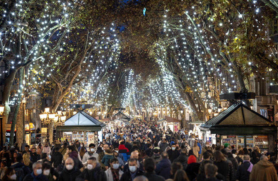 People among Christmas lights on La Rambla in Barcelona, Spain, on Dec. 23.