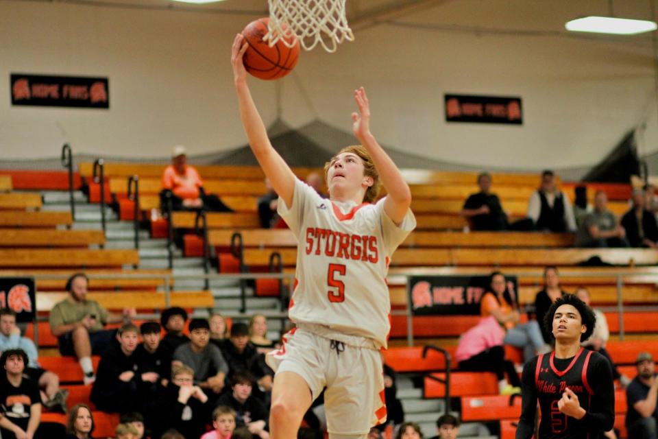 Lukis Bir glides in for a layup attempt against White Pigeon on Wednesday evening.