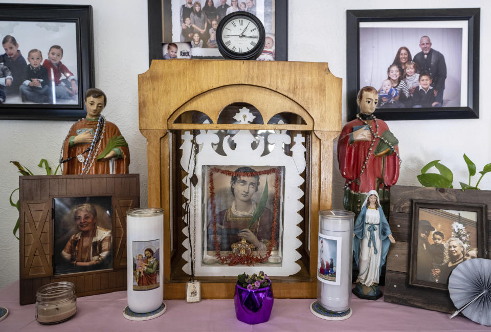 An altar dedicated to San Lorenzo, or Saint Lawrence, is displayed in the home of Barbara Finley, in Bernalillo, New Mexico, Monday, April 17, 2023. "For more than 300 years, Catholic faithful in this small town on the outskirts of Albuquerque have kept a special vow to St. Lawrence that includes one family each year setting up an altar for him in their home – and making it available 24/7 to anyone who wants to come pray. 'I’m not scared.' Finley said. 'They have knocked at my door at 2 am and I’ve let them in.'" (AP Photo/Roberto E. Rosales)