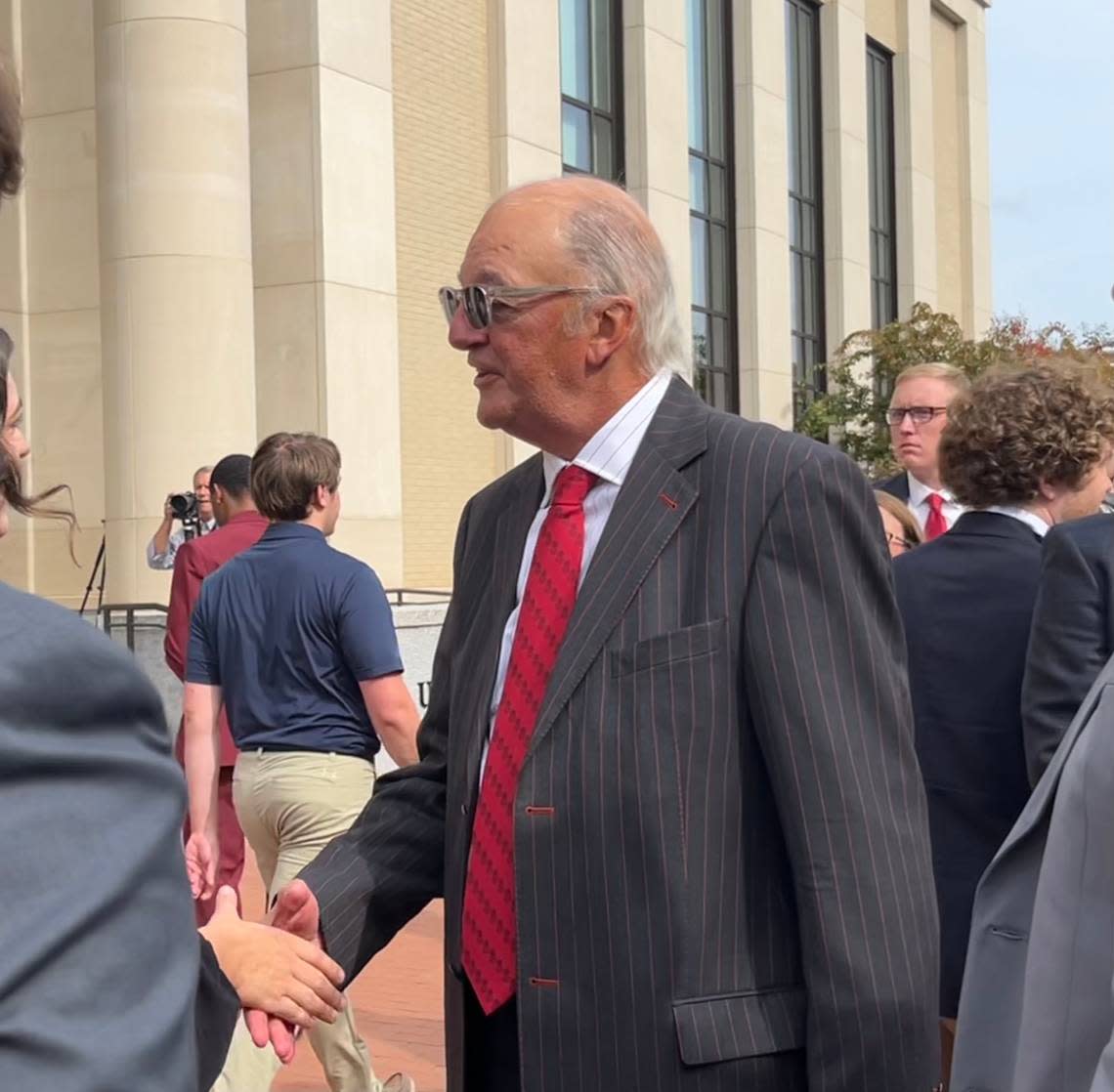 Joe Rice shakes hands with students at the renaming of the University of South Carolina’s School of Law.