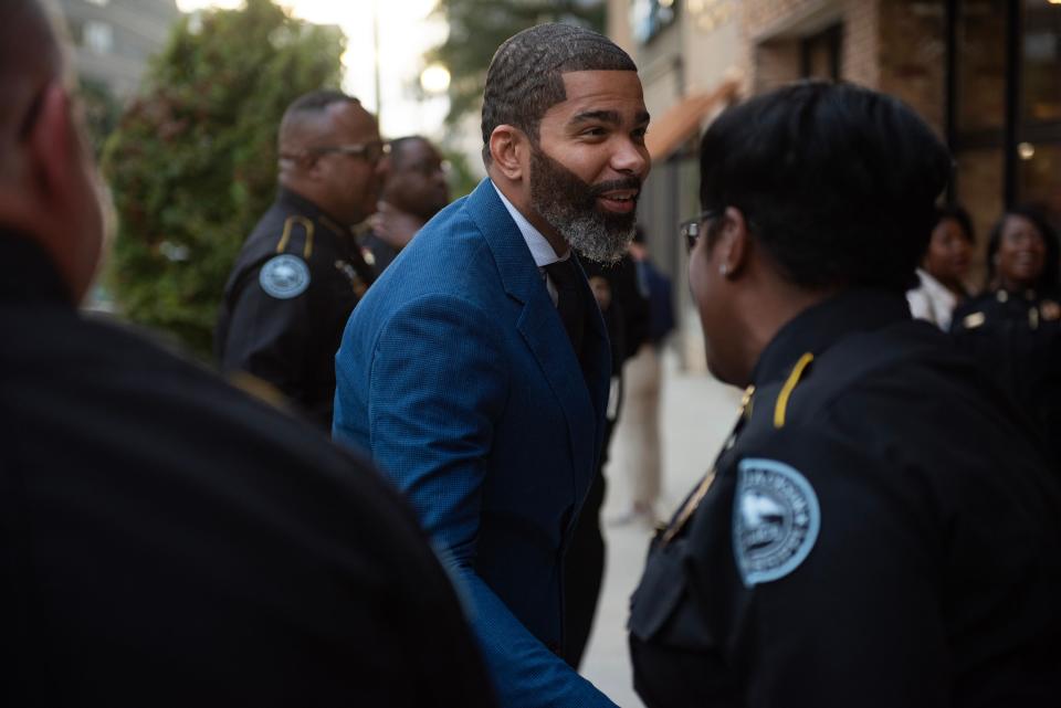 Jackson Mayor Chokwe Antar Lumumba shakes hands with Jackson Police Department officers before the State of the City address at The Rookery in Jackson, Miss., on Thursday, Oct. 26, 2023.
