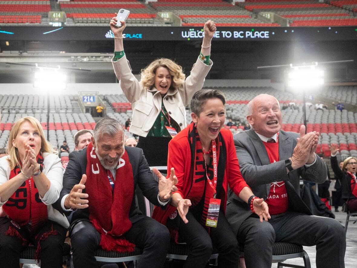 City of Vancouver and provincial delegates celebrate as Vancouver is selected as one of the 16 host cities for the FIFA 2026 men's World Cup. (Ben Nelms/CBC - image credit)