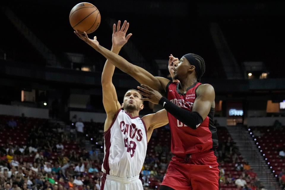 Houston Rockets guard Nate Hinton shoots over Cleveland Cavaliers forward Pete Nance during the NBA summer league championship game July 17 in Las Vegas.