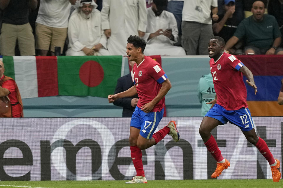 Costa Rica's Yeltsin Tejeda, left, celebrates after scoring his side's first goal during the World Cup group E soccer match between Costa Rica and Germany at the Al Bayt Stadium in Al Khor , Qatar, Thursday, Dec. 1, 2022. (AP Photo/Martin Meissner)