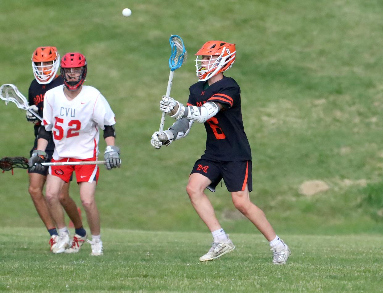 Middlebury's Logan McNulty sends a pass to a teammate during the Tigers 9-5 win over CVU in the 2023 D1 semifinals.