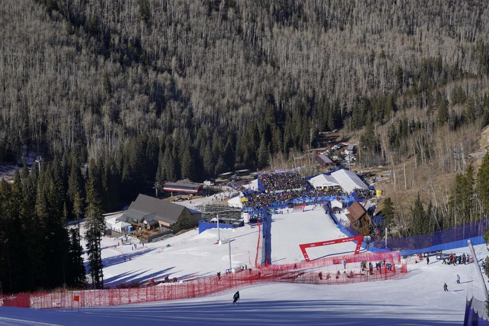 FILE - The wooded area surrounding the finish line at a World Cup downhill ski race in Beaver Creek, Colo., is devoid of snow Dec. 4, 2021. Olympic athletes in Alpine skiing and other outdoor sports dependent on snow are worried as they see winters disappearing. (AP Photo/Robert F. Bukaty, File)