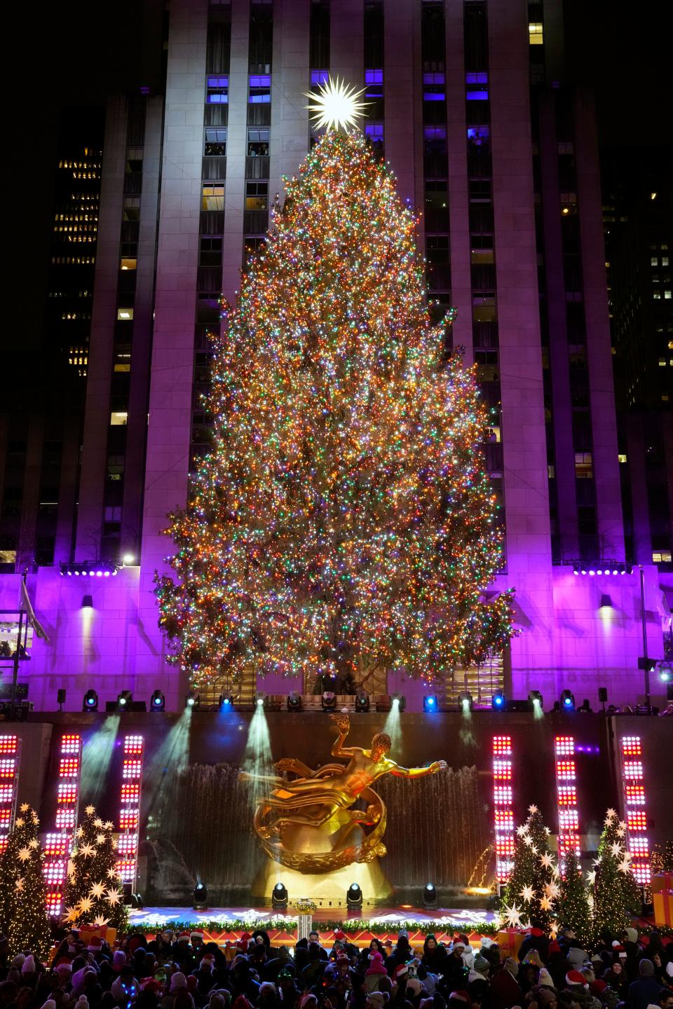 The Rockefeller Center Christmas tree is lit Wednesday in New York City.