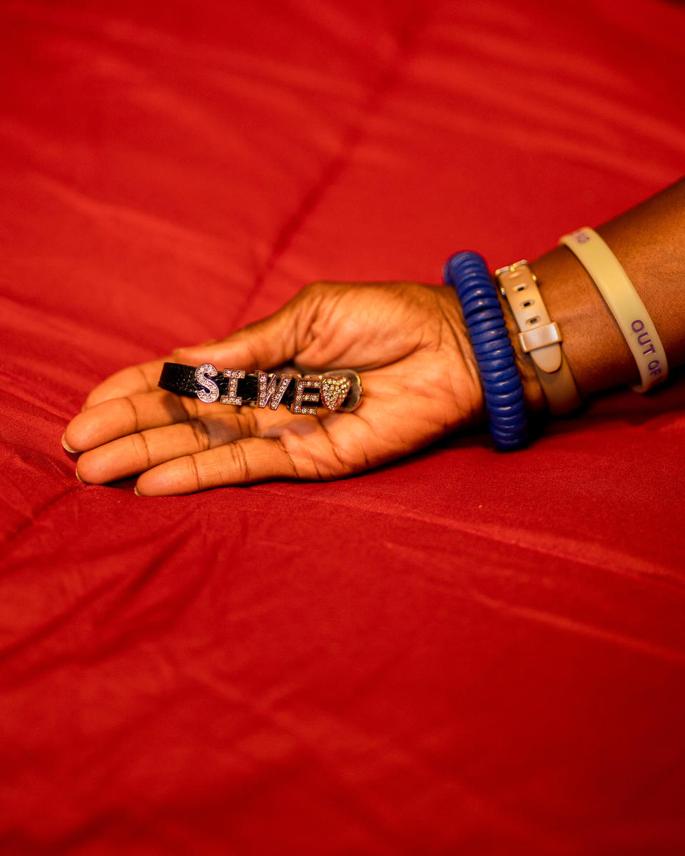 Dionne Monsanto holds a bracelet that Siwe made. “With a name like Busisiwe Ayo Monsanto...she could never buy anything pre-made with her name. So it was a big deal that there was a place that she could do that,” Monsanto says.Elias Williams for TIME