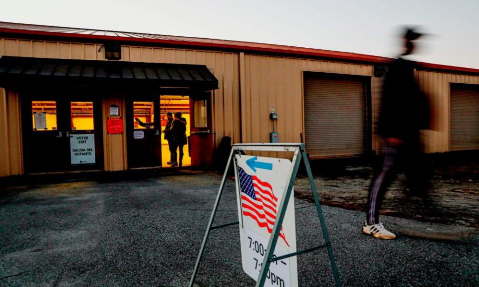 Voters enter and exit a polling station at the Gwinnett County Fairgrounds on 5 January 2021 in Lawrenceville, Georgia.