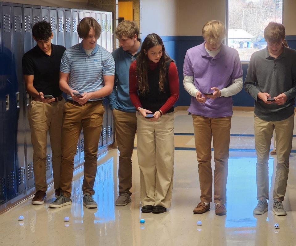 Students in Darwin Daugaard's class at O'Gorman High School learn about velocity and acceleration in a race with their spheros robotic balls.