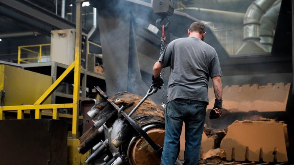 A worker stays on the job at Wisconsin Aluminum Foundry in Manitowoc, while the state and national economy face a crisis amid the coronavirus pandemic.