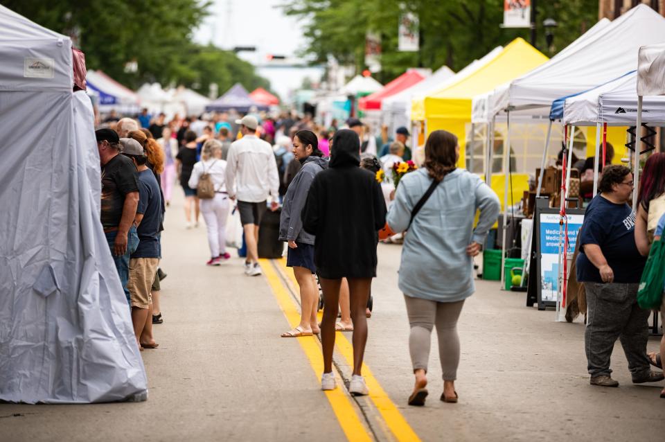 Shoppers browse last year's Farmers Market on Broadway. For its 21st season, which opens Wednesday, the event will have several themed markets to celebrate cultural holidays.